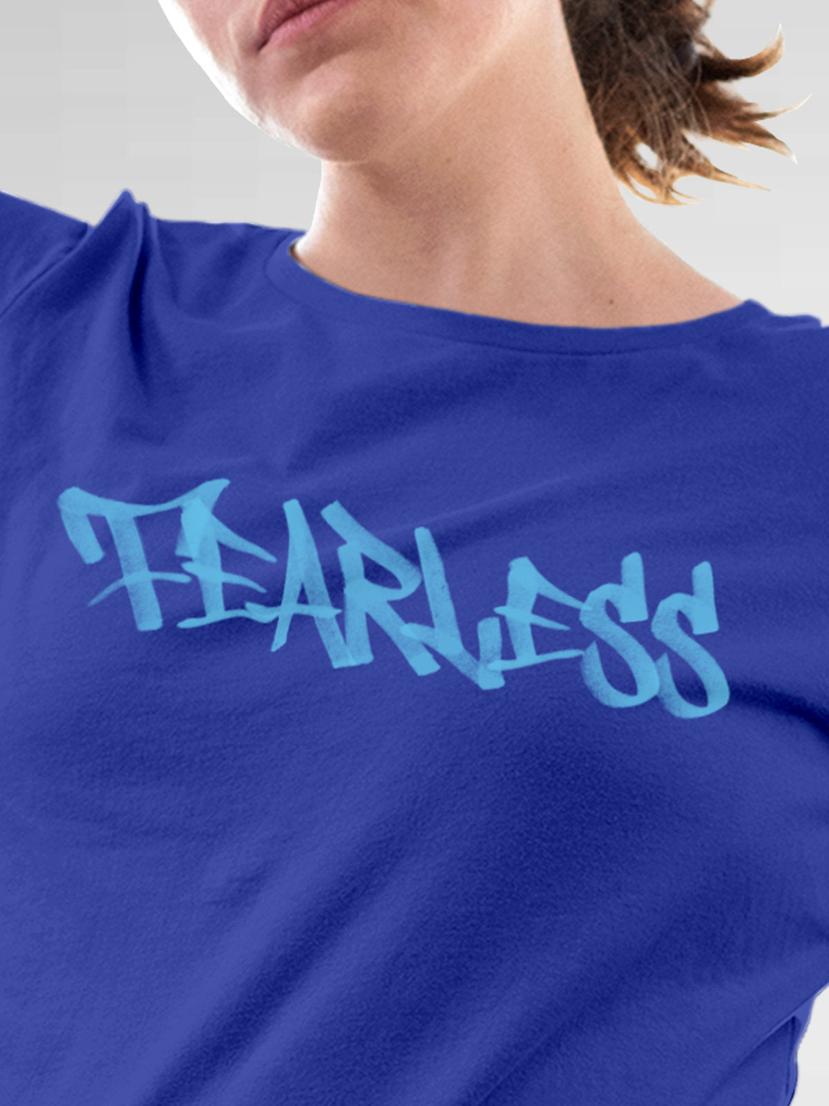 Close up of 'Fearless' design on Women's Blue Round Neck T-shirt, highlighting intricate details and vibrant print.