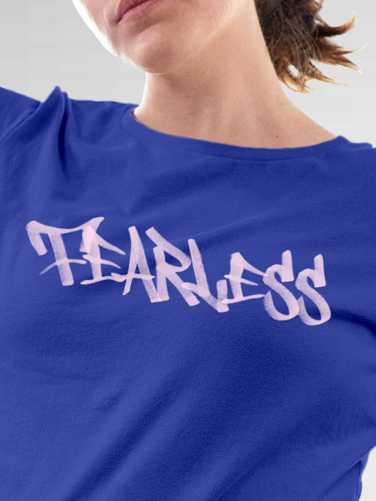 Close up of 'Fearless' design on Women's Blue Round Neck T-shirt, highlighting intricate details and vibrant print.