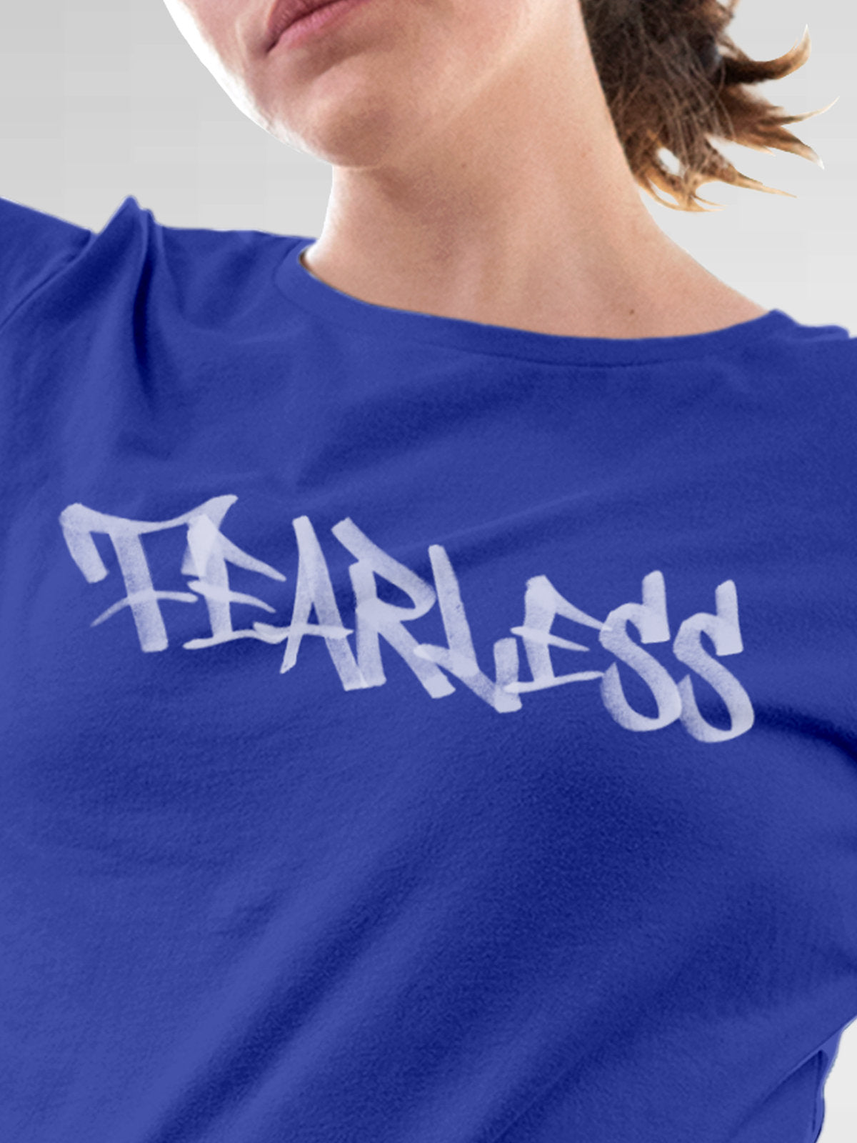 Close up of 'Fearless' design on Women's Blue Round Neck T-shirt, highlighting intricate details and vibrant print.