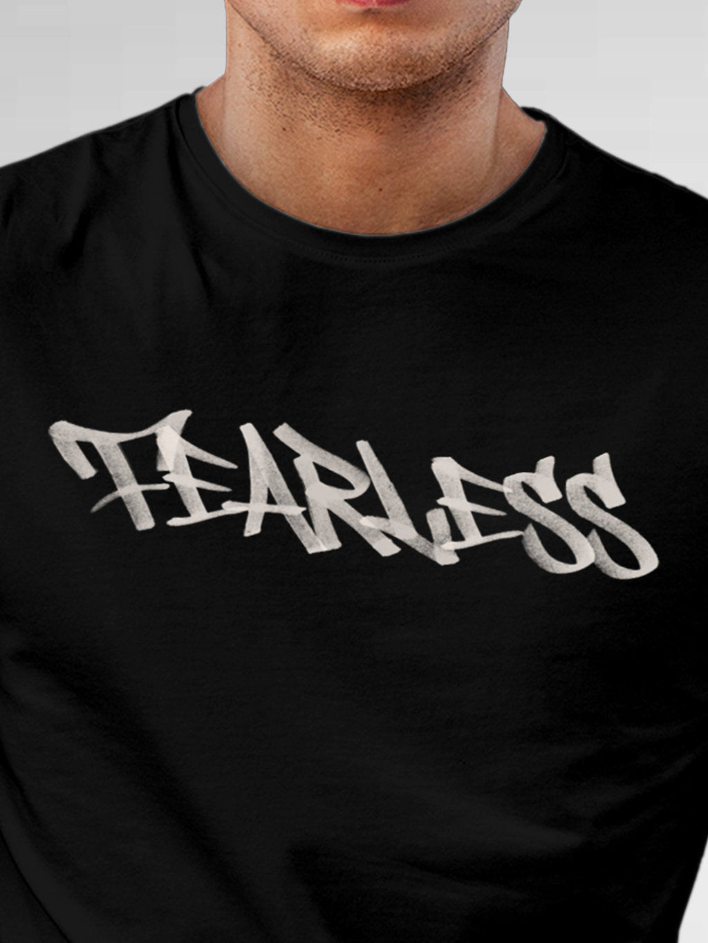 Close up of 'Fearless' design on Men's Black Round Neck T-shirt, highlighting intricate details and vibrant print.