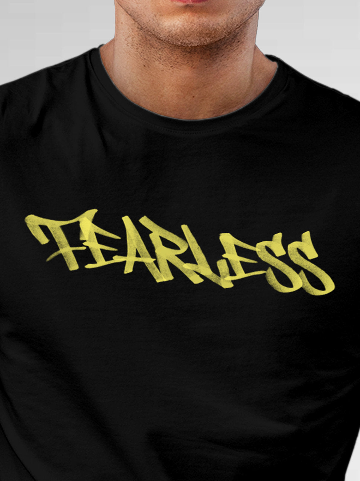 Close up of 'Fearless' design on Men's Black Round Neck T-shirt, highlighting intricate details and vibrant print.