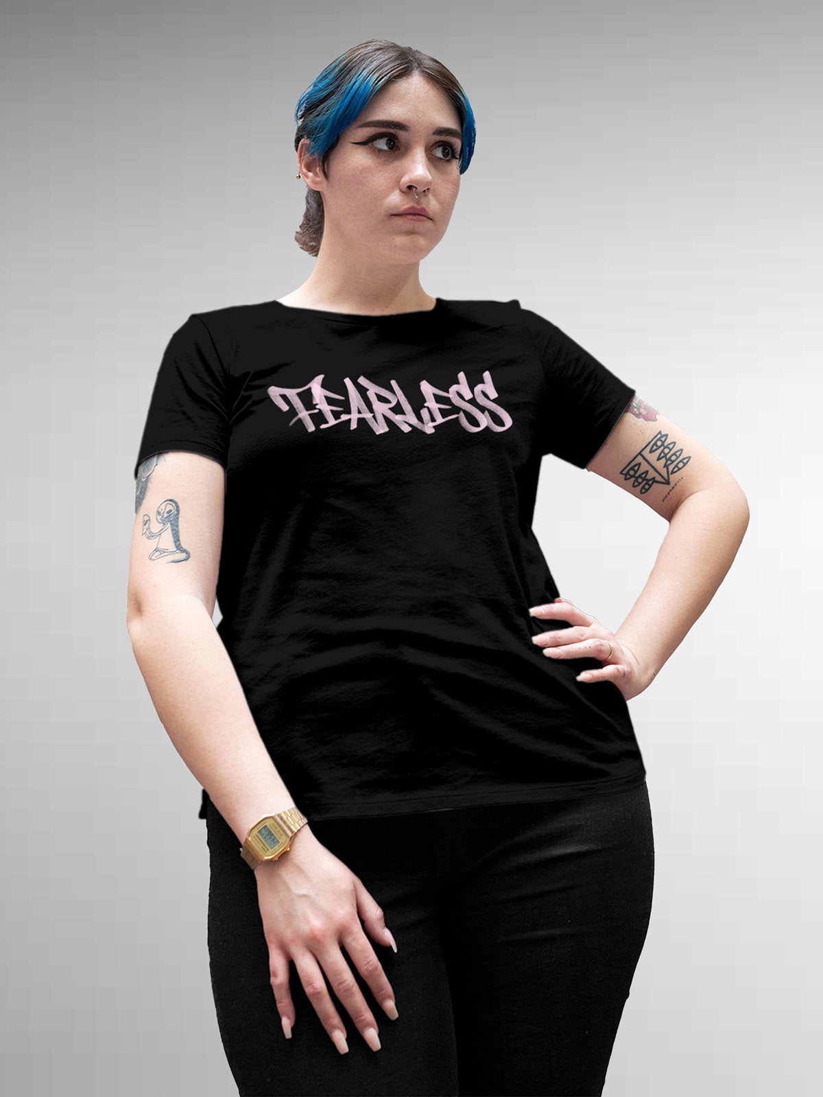 Model wearing Women's Black Round Neck T-shirt with 'Fearless' design, offering effortless style and premium comfort