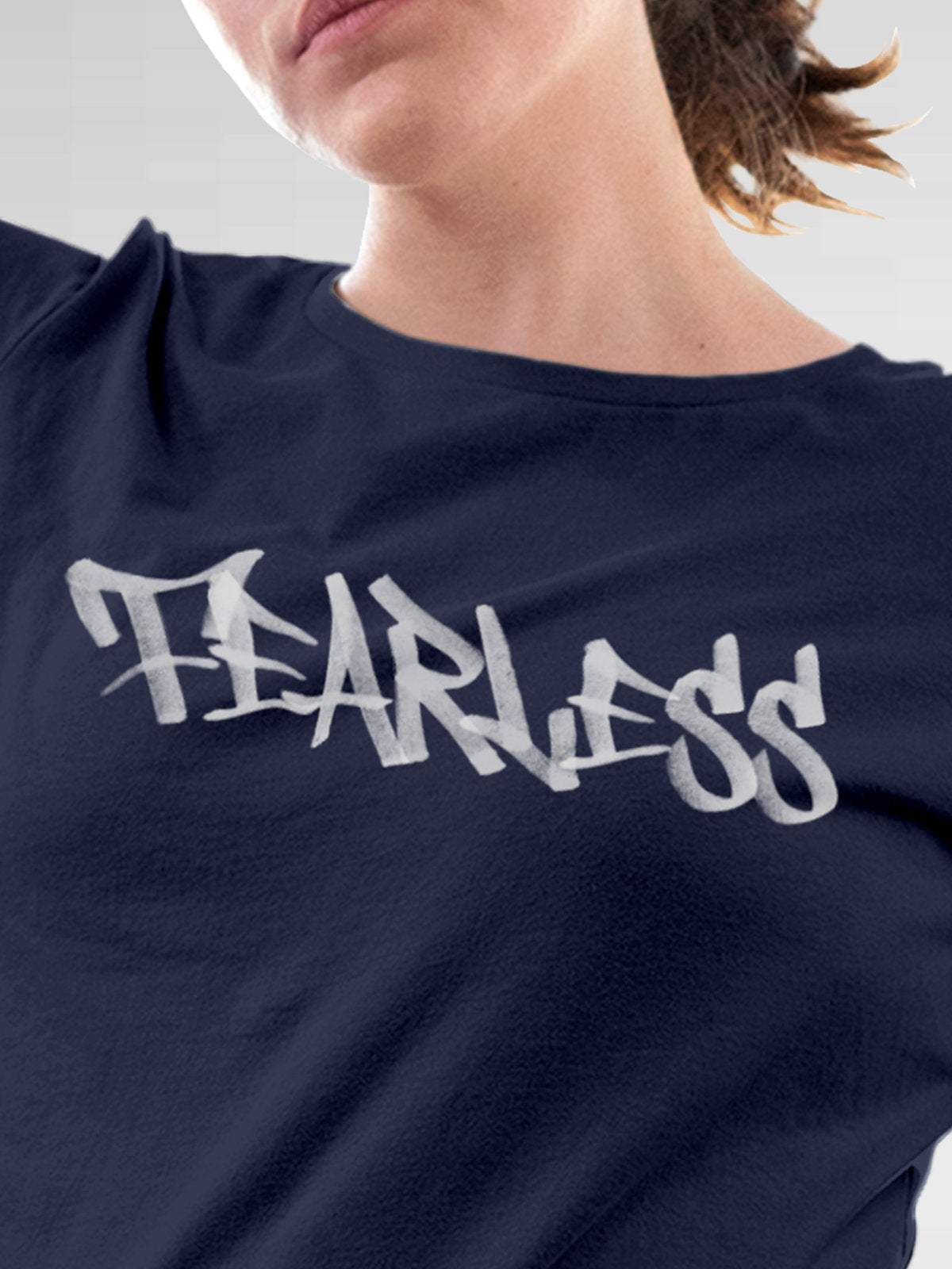 Close up of 'Fearless' design on Women's Navy Blue Round Neck T-shirt, highlighting intricate details and vibrant print.