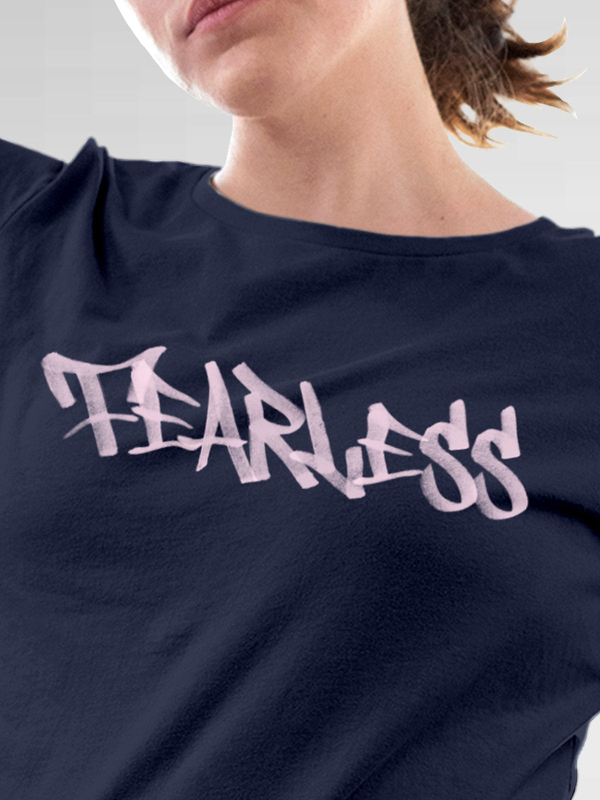 Close up of 'Fearless' design on Women's Navy Blue Round Neck T-shirt, highlighting intricate details and vibrant print.