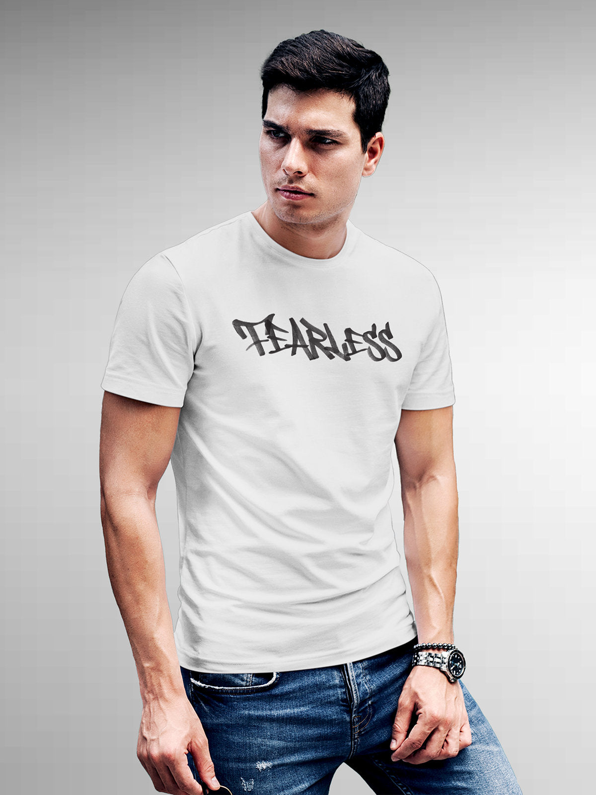 Model wearing Men's White Round Neck T-shirt with 'Fearless' design, offering effortless style and premium comfort
