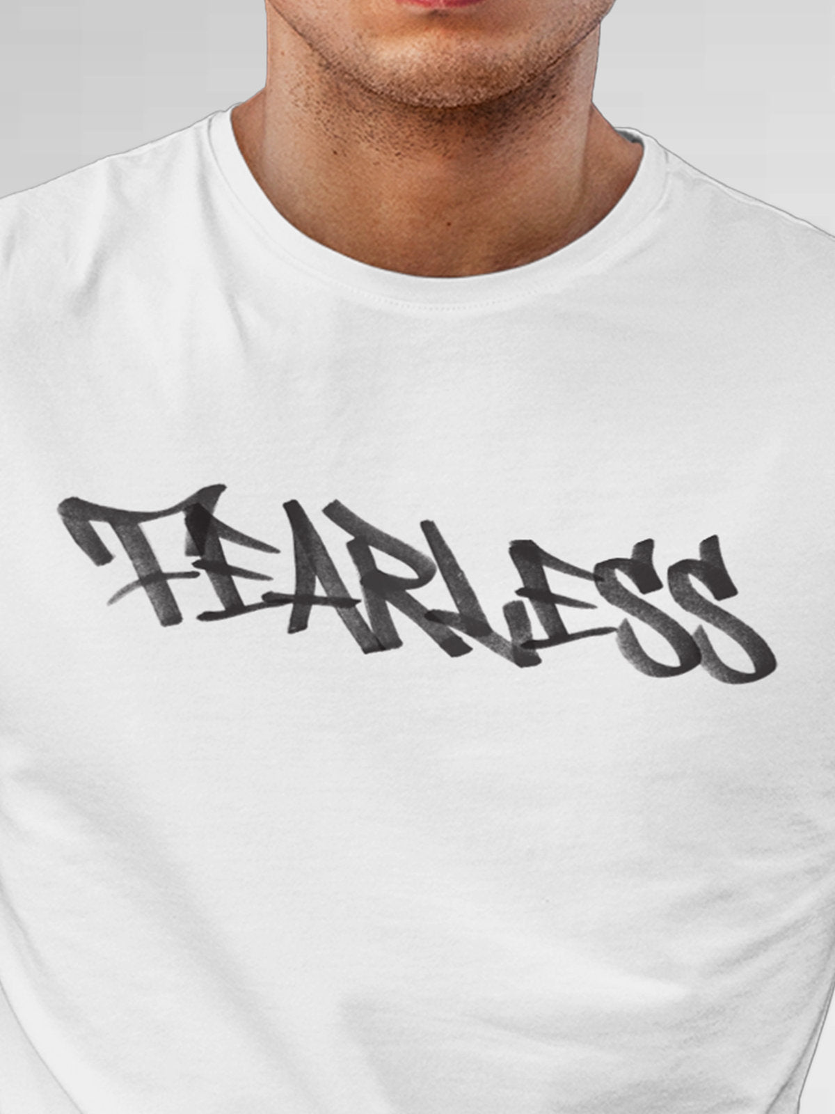 Close up of 'Fearless' design on Men's White Round Neck T-shirt, highlighting intricate details and vibrant print.