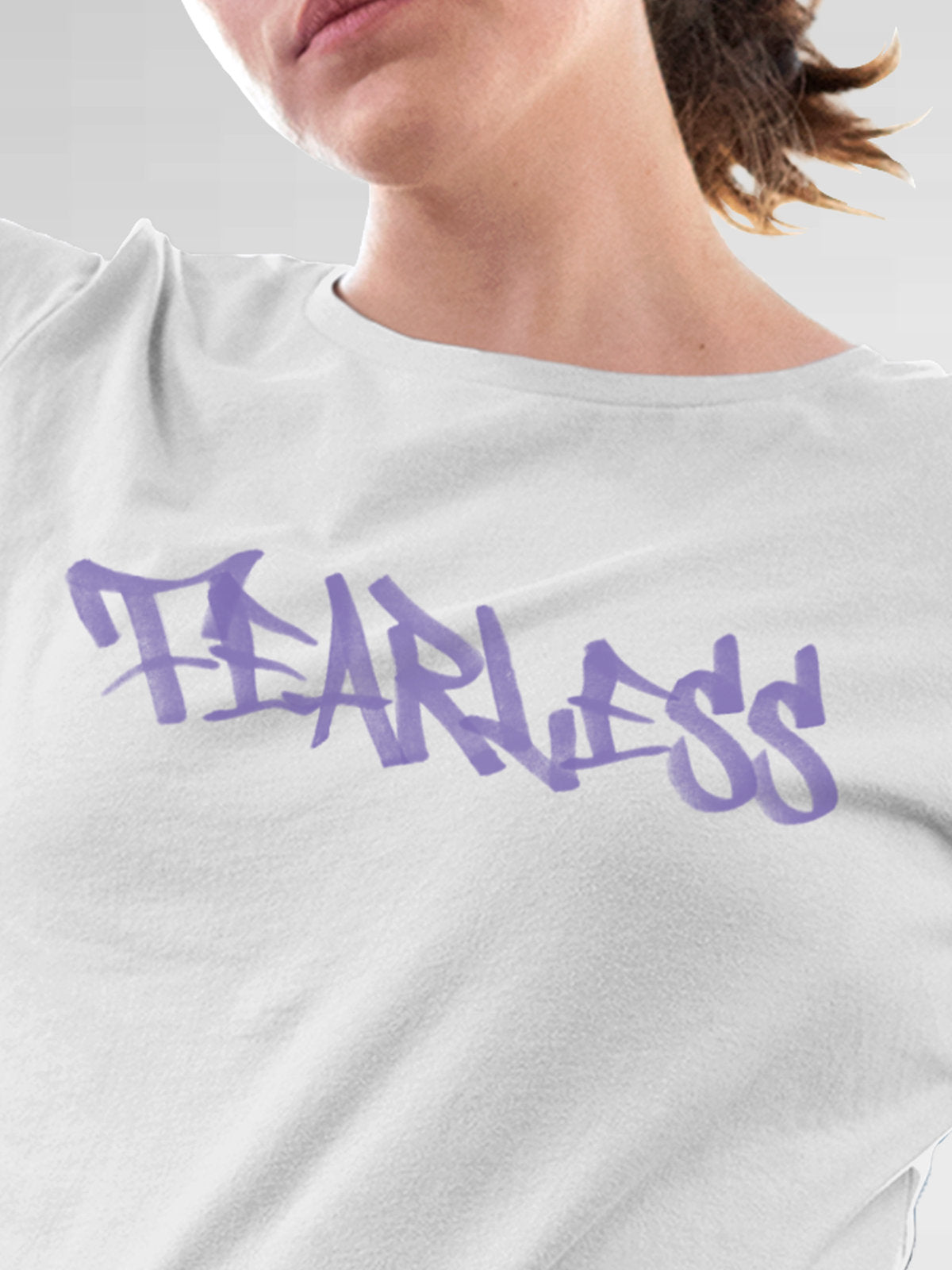 Close up of 'Fearless' design on Women's White Round Neck T-shirt, highlighting intricate details and vibrant print.