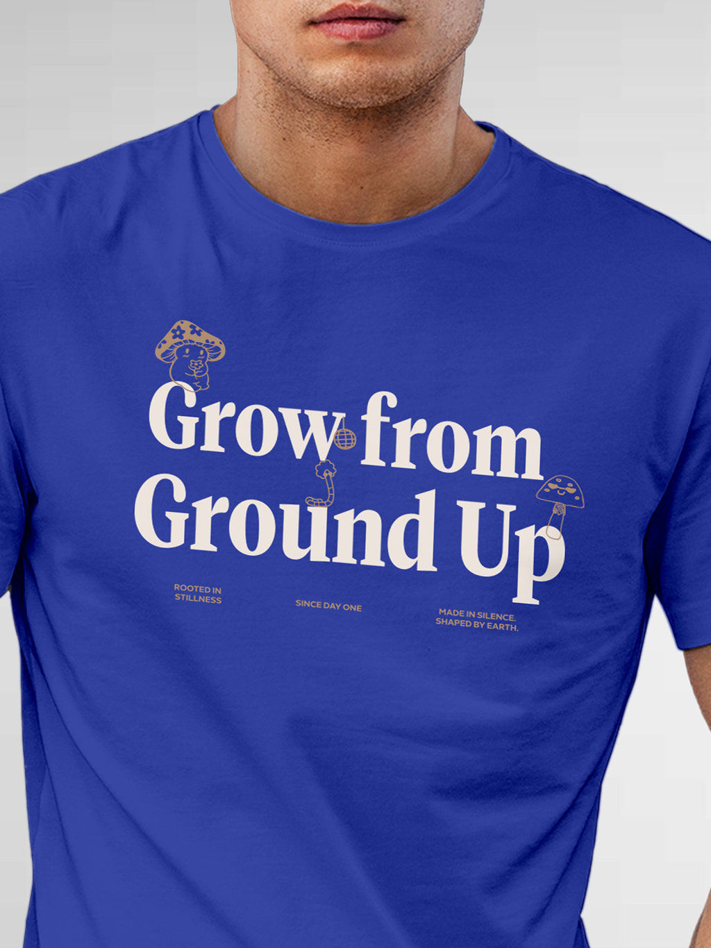 Close up of 'Grow From Ground Up' design on Men's Blue Round Neck T-shirt, highlighting intricate details and vibrant print.