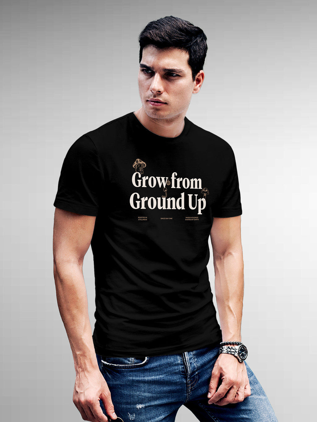 Model wearing Men's Black Round Neck T-shirt with 'Grow From Ground Up' design, offering effortless style and premium comfort