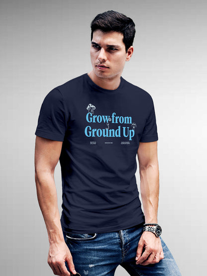 Model wearing Men's Navy Blue Round Neck T-shirt with 'Grow From Ground Up' design, offering effortless style and premium comfort