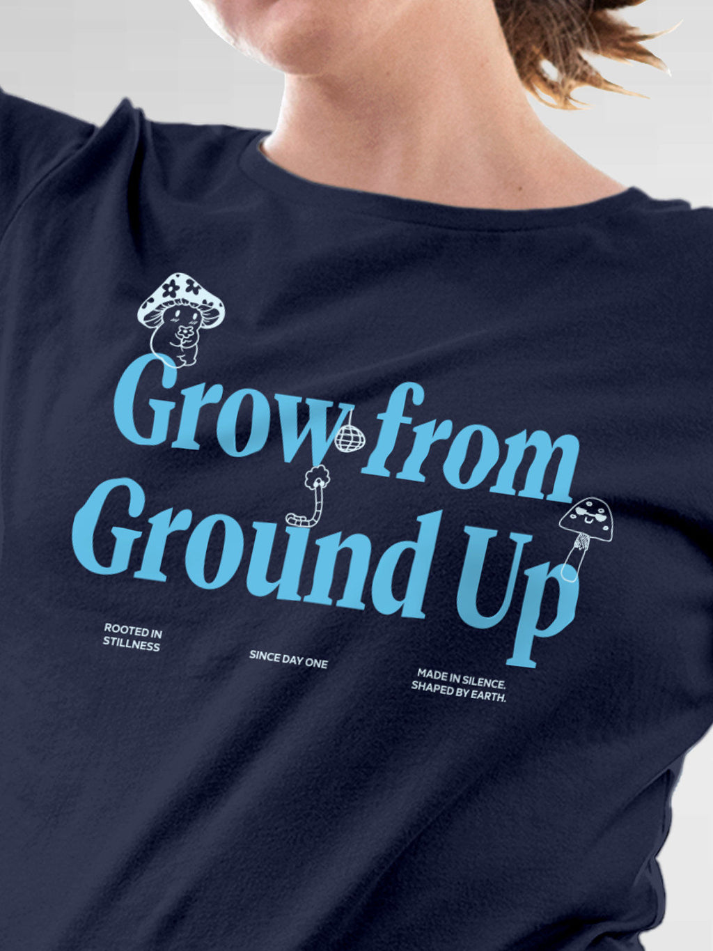Close up of 'Grow From Ground Up' design on Women's Navy Blue Round Neck T-shirt, highlighting intricate details and vibrant print.