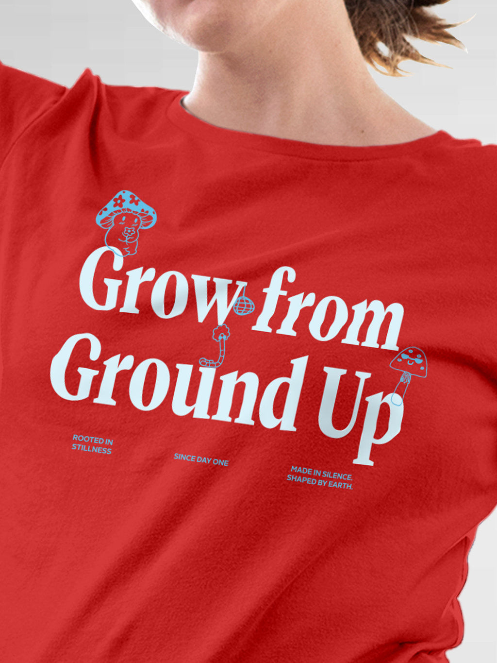 Close up of 'Grow From Ground Up' design on Women's Red Round Neck T-shirt, highlighting intricate details and vibrant print.