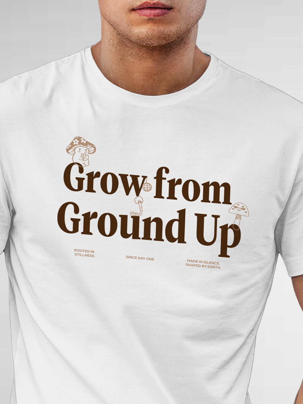 Close up of 'Grow From Ground Up' design on Men's White Round Neck T-shirt, highlighting intricate details and vibrant print.