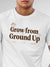 Close up of 'Grow From Ground Up' design on Men's White Round Neck T-shirt, highlighting intricate details and vibrant print.
