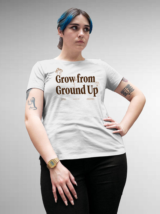 Model wearing Women's White Round Neck T-shirt with 'Grow From Ground Up' design, offering effortless style and premium comfort