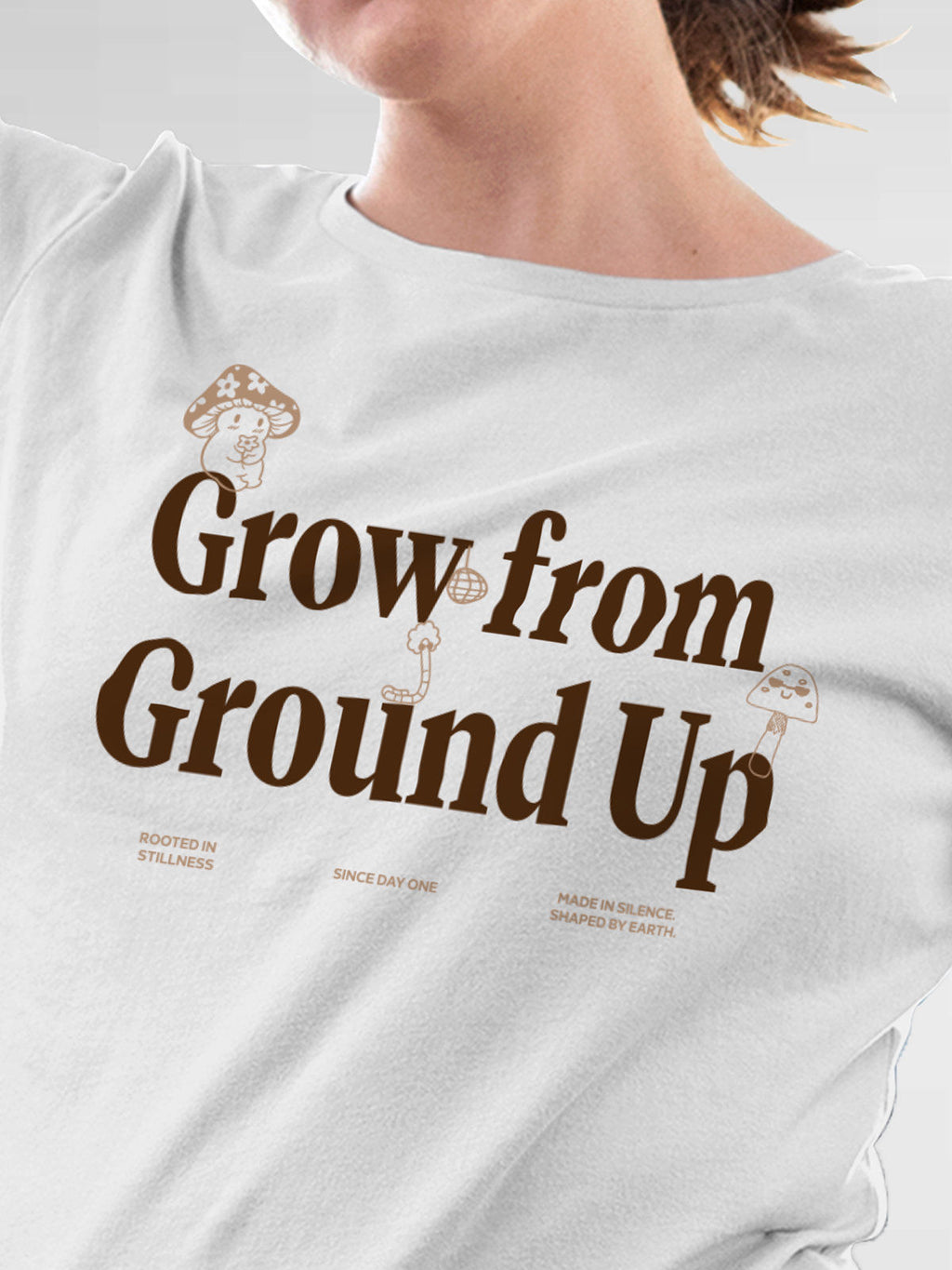 Close up of 'Grow From Ground Up' design on Women's White Round Neck T-shirt, highlighting intricate details and vibrant print.
