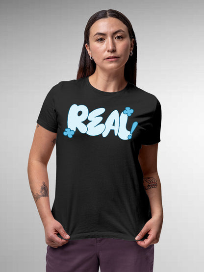 Model wearing Women's Dark Grey Round Neck T-shirt with 'Real' design, offering effortless style and premium comfort