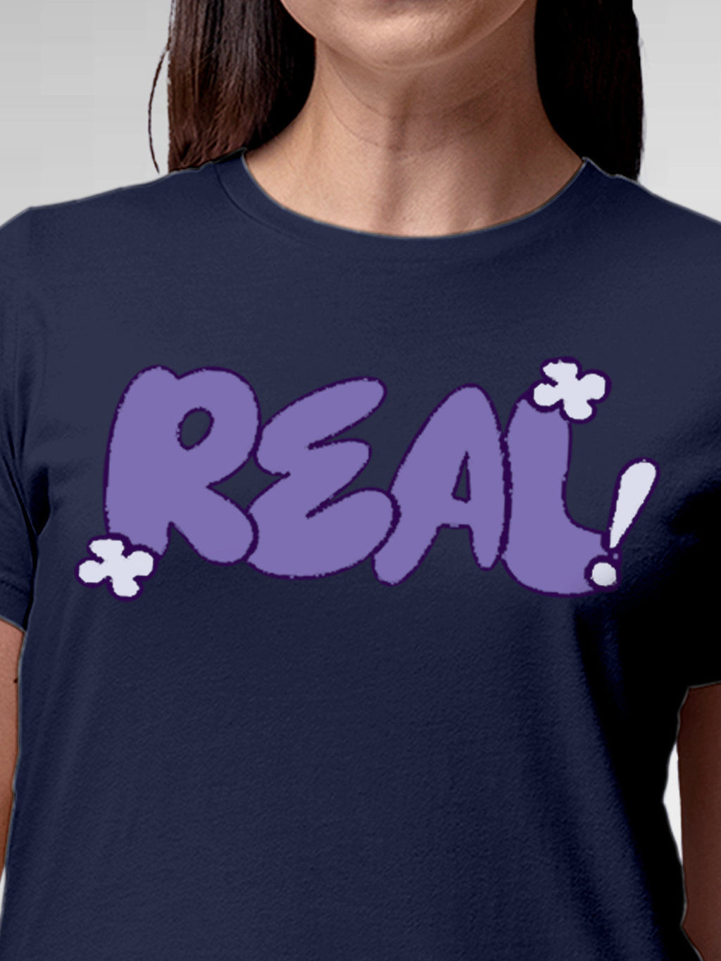 Close up of 'Real' design on Women's Navy Blue Round Neck T-shirt, highlighting intricate details and vibrant print.