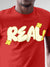 Close up of 'Real' design on Men's Red Round Neck T-shirt, highlighting intricate details and vibrant print.