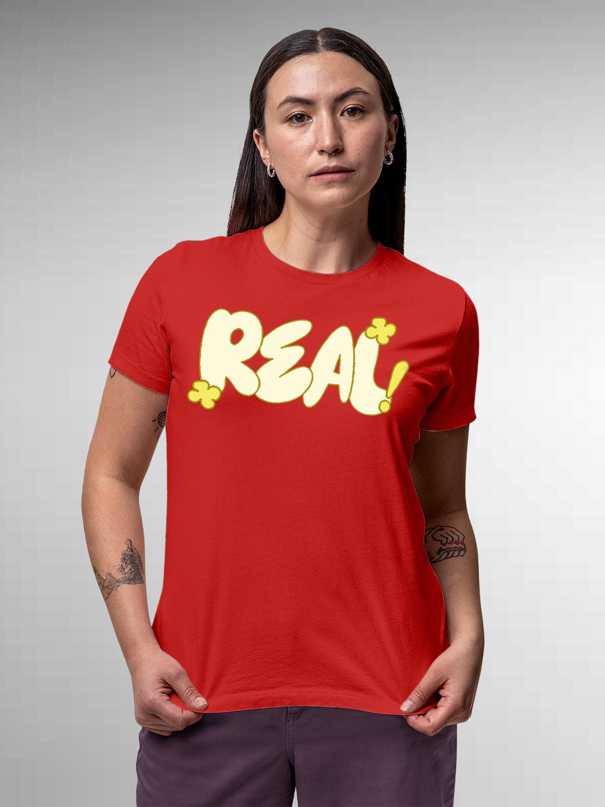 Model wearing Women's Red Round Neck T-shirt with 'Real' design, offering effortless style and premium comfort