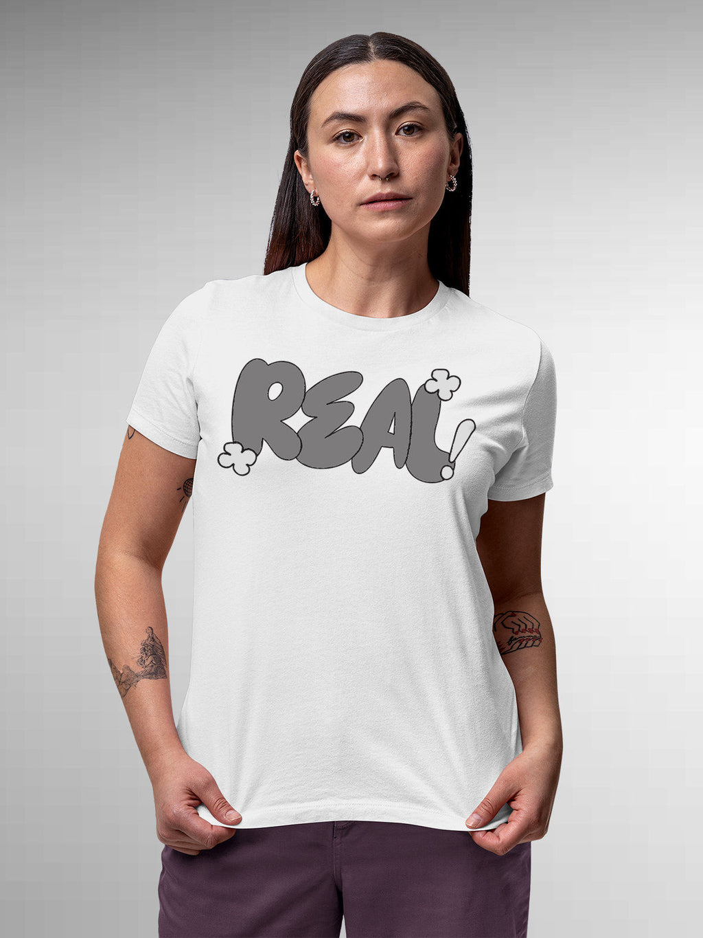 Model wearing Women's White Round Neck T-shirt with 'Real' design, offering effortless style and premium comfort