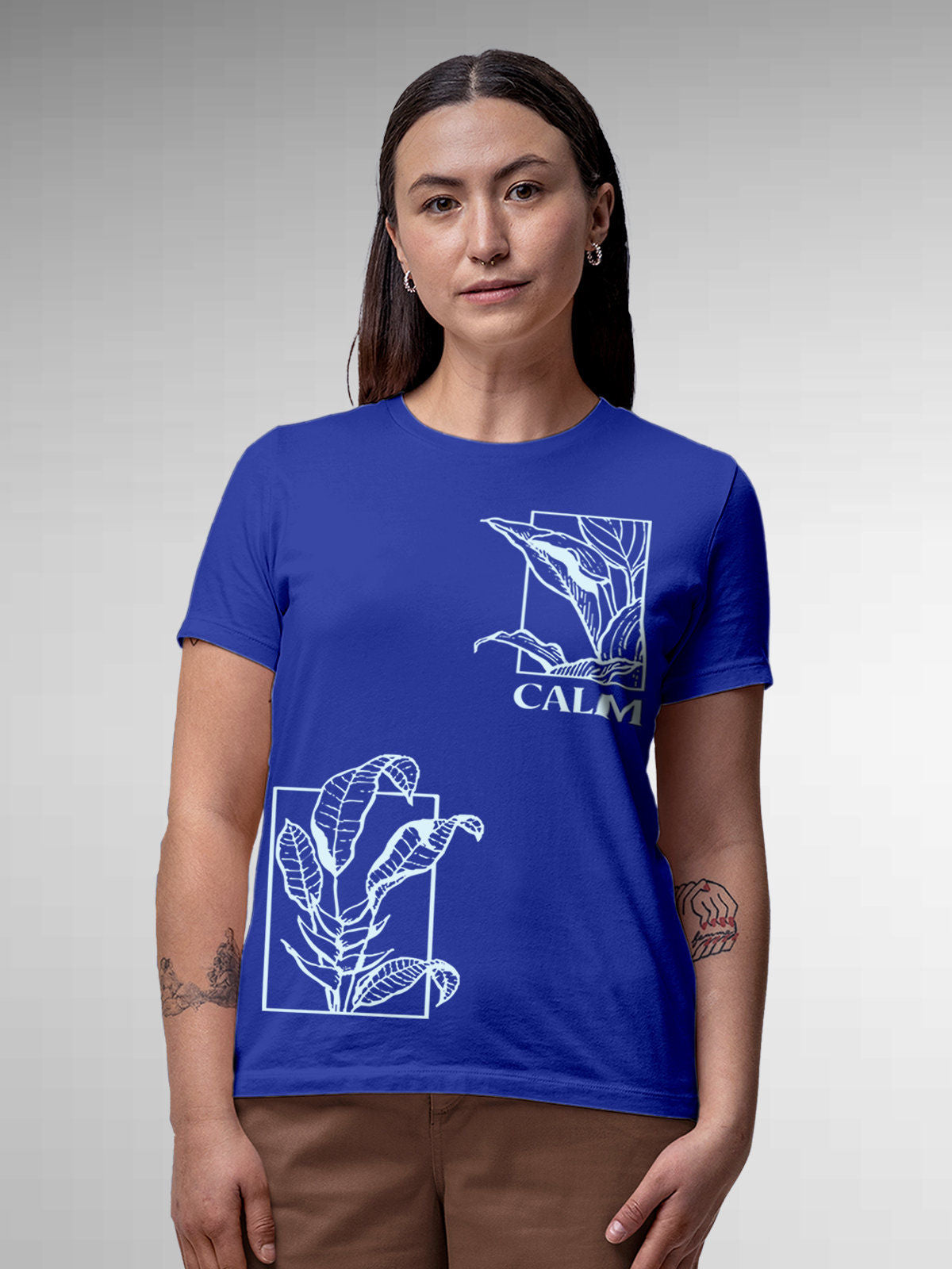 Model wearing Women's Blue Round Neck T-shirt with 'Calm' design, offering effortless style and premium comfort