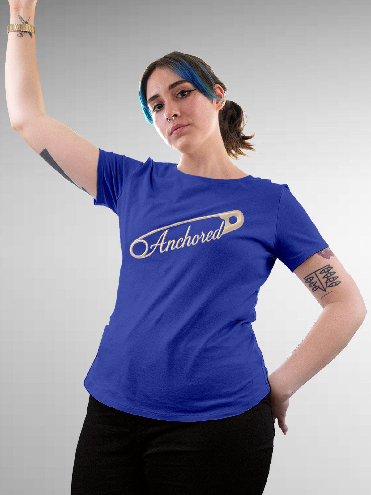 Model wearing Women's Blue Round Neck T-shirt with 'Anchored' design, offering effortless style and premium comfort