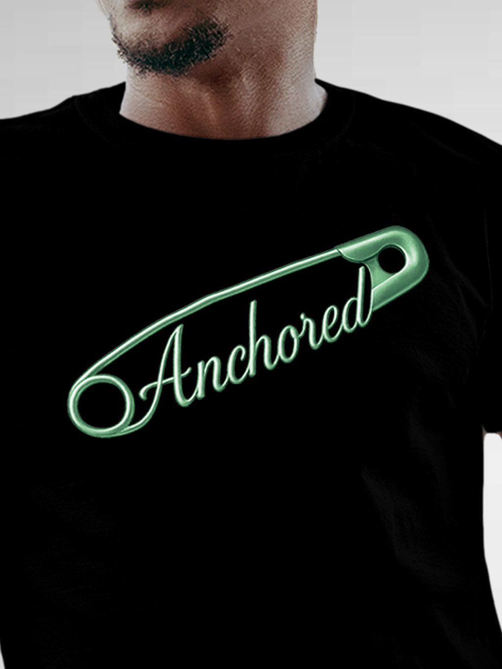 Close up of 'Anchored' design on Men's Black Round Neck T-shirt, highlighting intricate details and vibrant print.