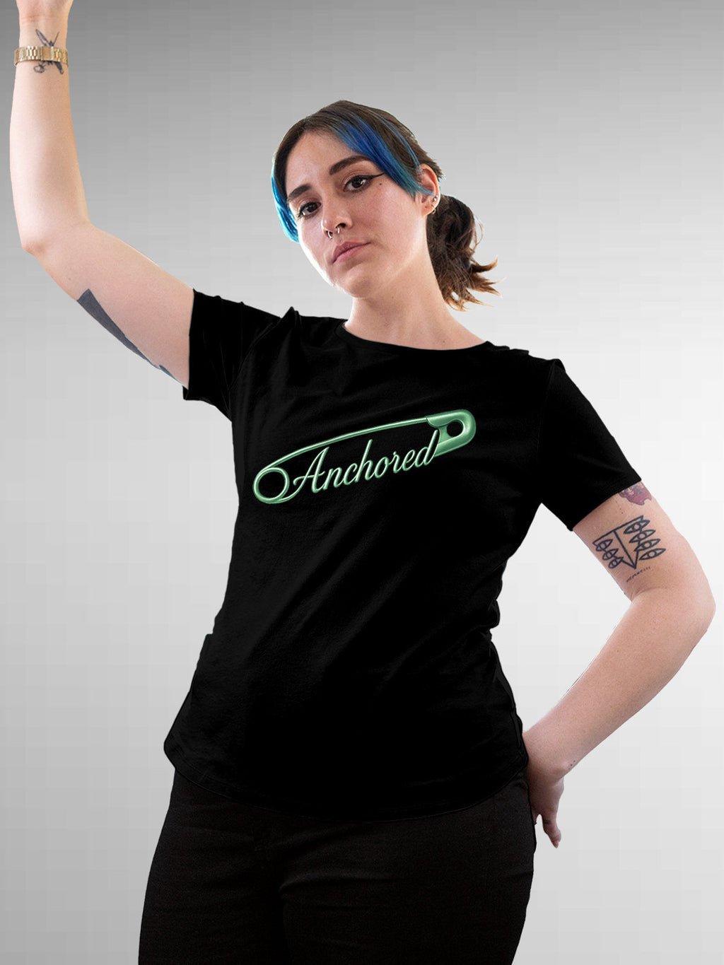 Model wearing Women's Black Round Neck T-shirt with 'Anchored' design, offering effortless style and premium comfort