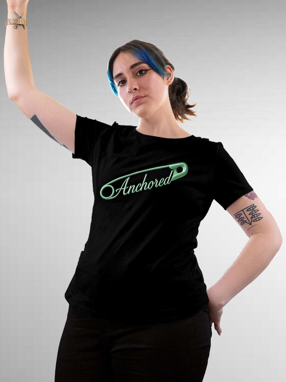 Model wearing Women's Black Round Neck T-shirt with 'Anchored' design, offering effortless style and premium comfort