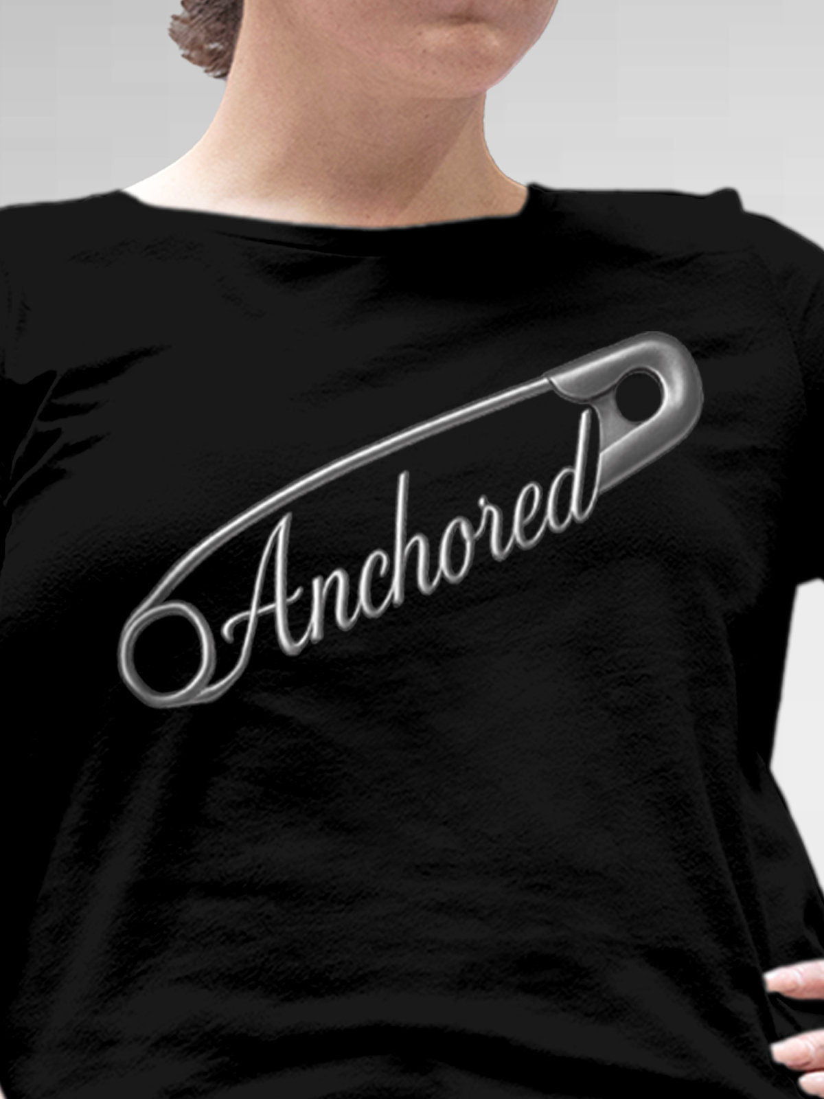 Close up of 'Anchored' design on Women's Black Round Neck T-shirt, highlighting intricate details and vibrant print.