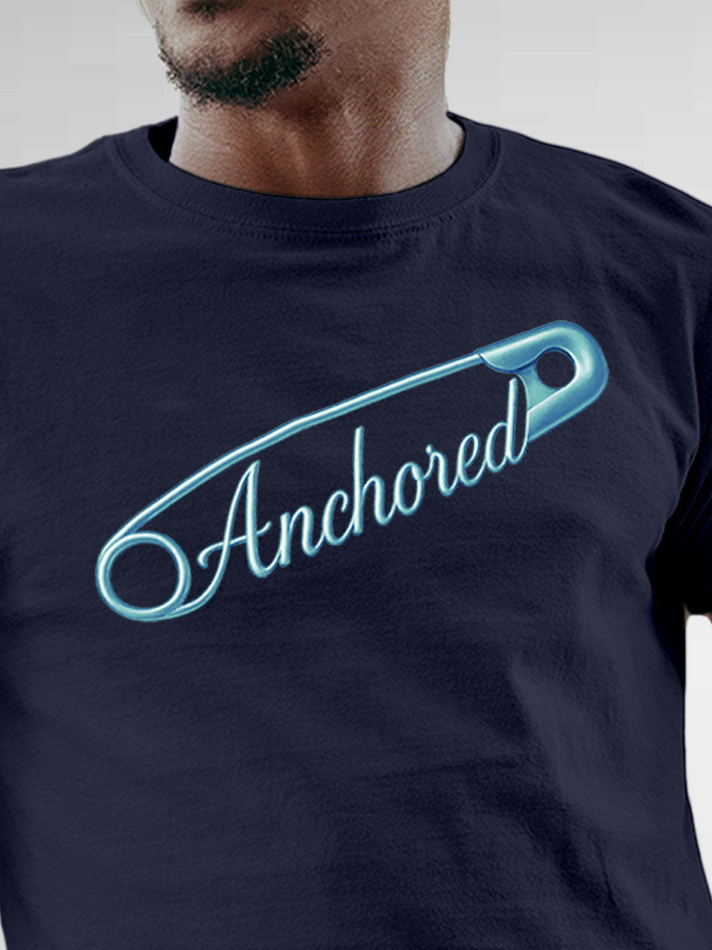 Close up of 'Anchored' design on Men's Navy Blue Round Neck T-shirt, highlighting intricate details and vibrant print.