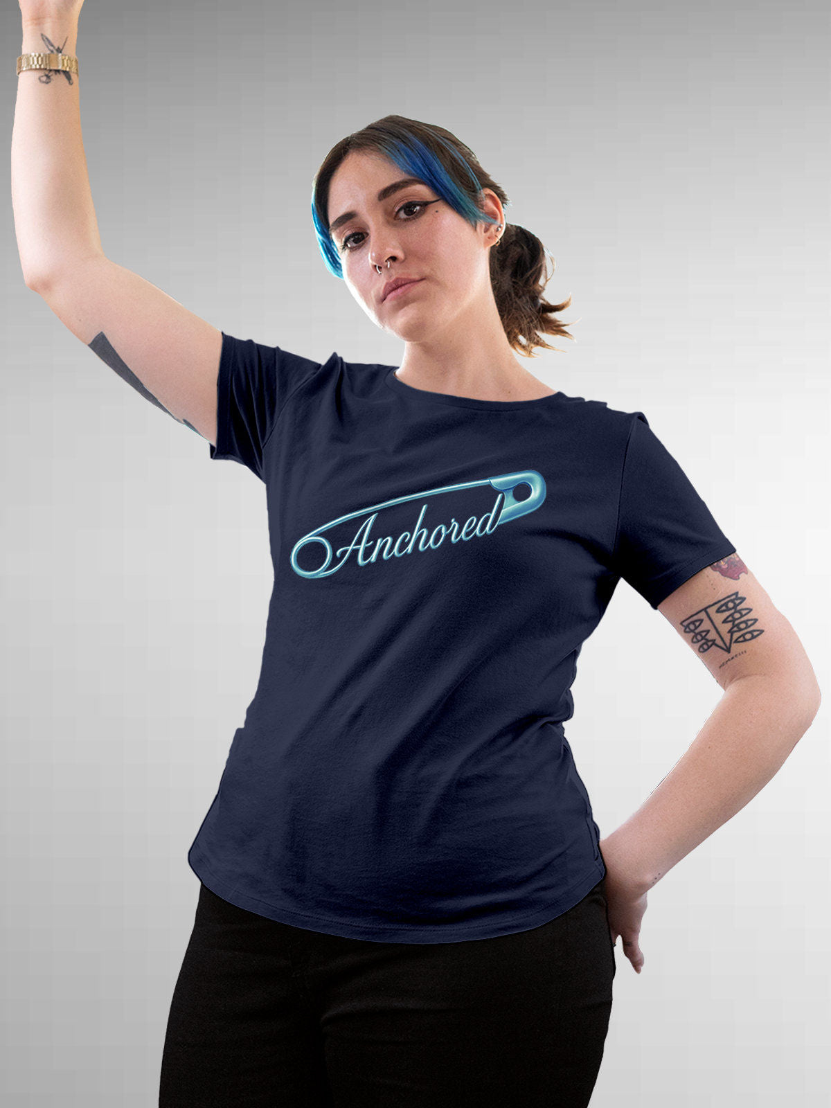 Model wearing Women's Navy Blue Round Neck T-shirt with 'Anchored' design, offering effortless style and premium comfort