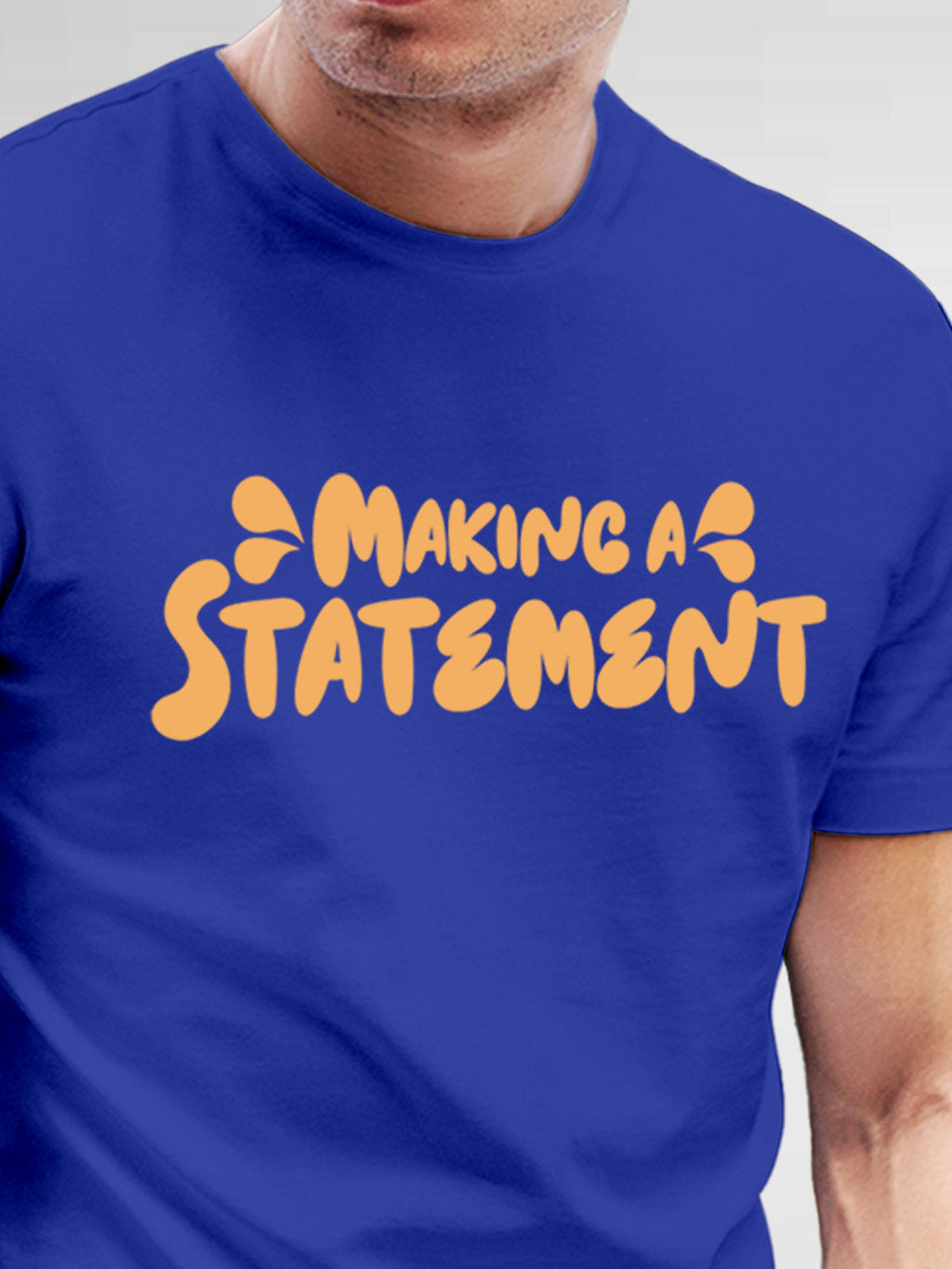 Close up of 'Making A Statement' design on Men's Blue Round Neck T-shirt, highlighting intricate details and vibrant print.