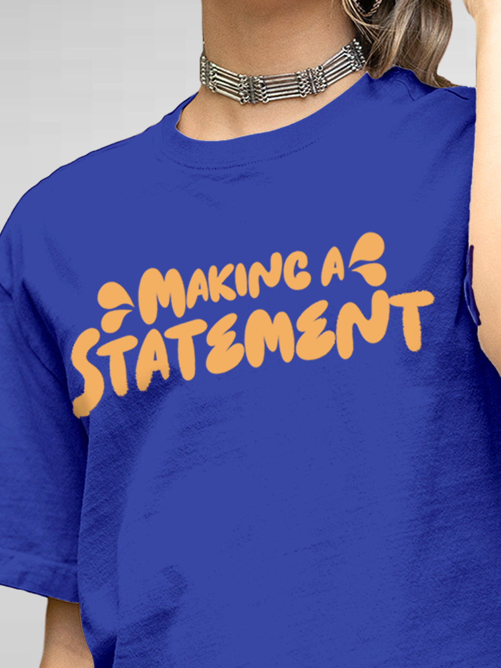 Close up of 'Making A Statement' design on Women's Blue Round Neck T-shirt, highlighting intricate details and vibrant print.