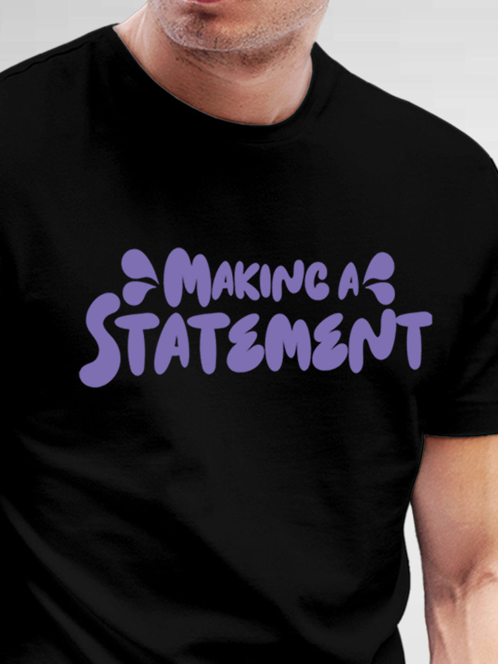 Close up of 'Making A Statement' design on Men's Black Round Neck T-shirt, highlighting intricate details and vibrant print.