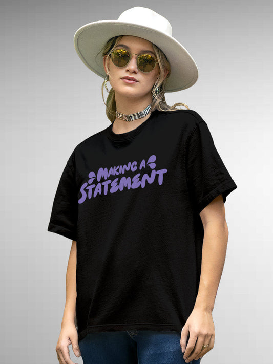Model wearing Women's Black Round Neck T-shirt with 'Making A Statement' design, offering effortless style and premium comfort