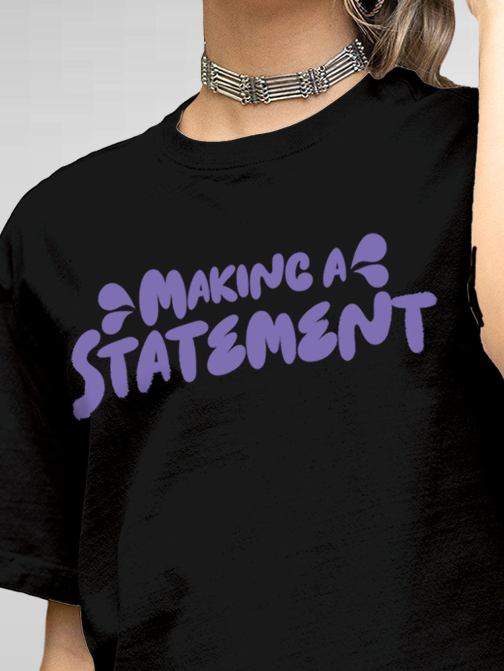 Close up of 'Making A Statement' design on Women's Black Round Neck T-shirt, highlighting intricate details and vibrant print.