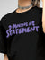 Close up of 'Making A Statement' design on Women's Black Round Neck T-shirt, highlighting intricate details and vibrant print.
