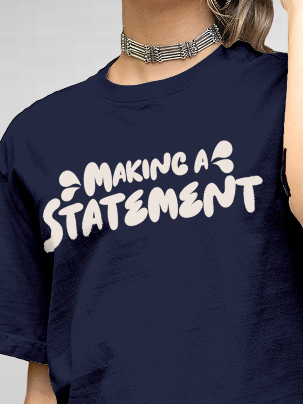 Close up of 'Making A Statement' design on Women's Navy Blue Round Neck T-shirt, highlighting intricate details and vibrant print.