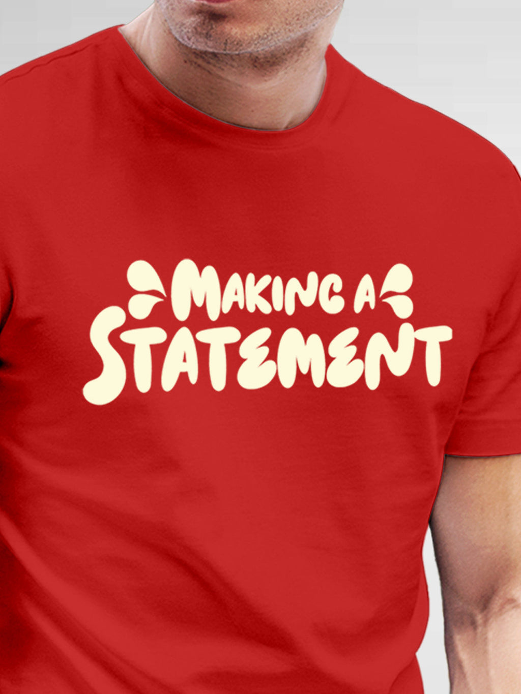 Close up of 'Making A Statement' design on Men's Red Round Neck T-shirt, highlighting intricate details and vibrant print.