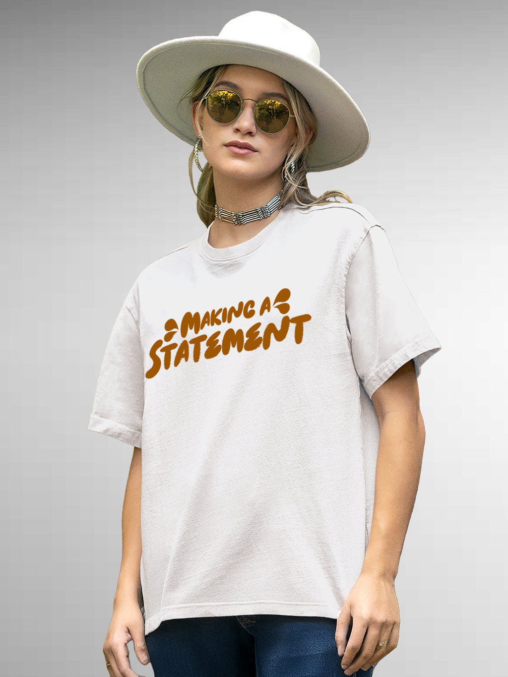 Model wearing Women's White Round Neck T-shirt with 'Making A Statement' design, offering effortless style and premium comfort