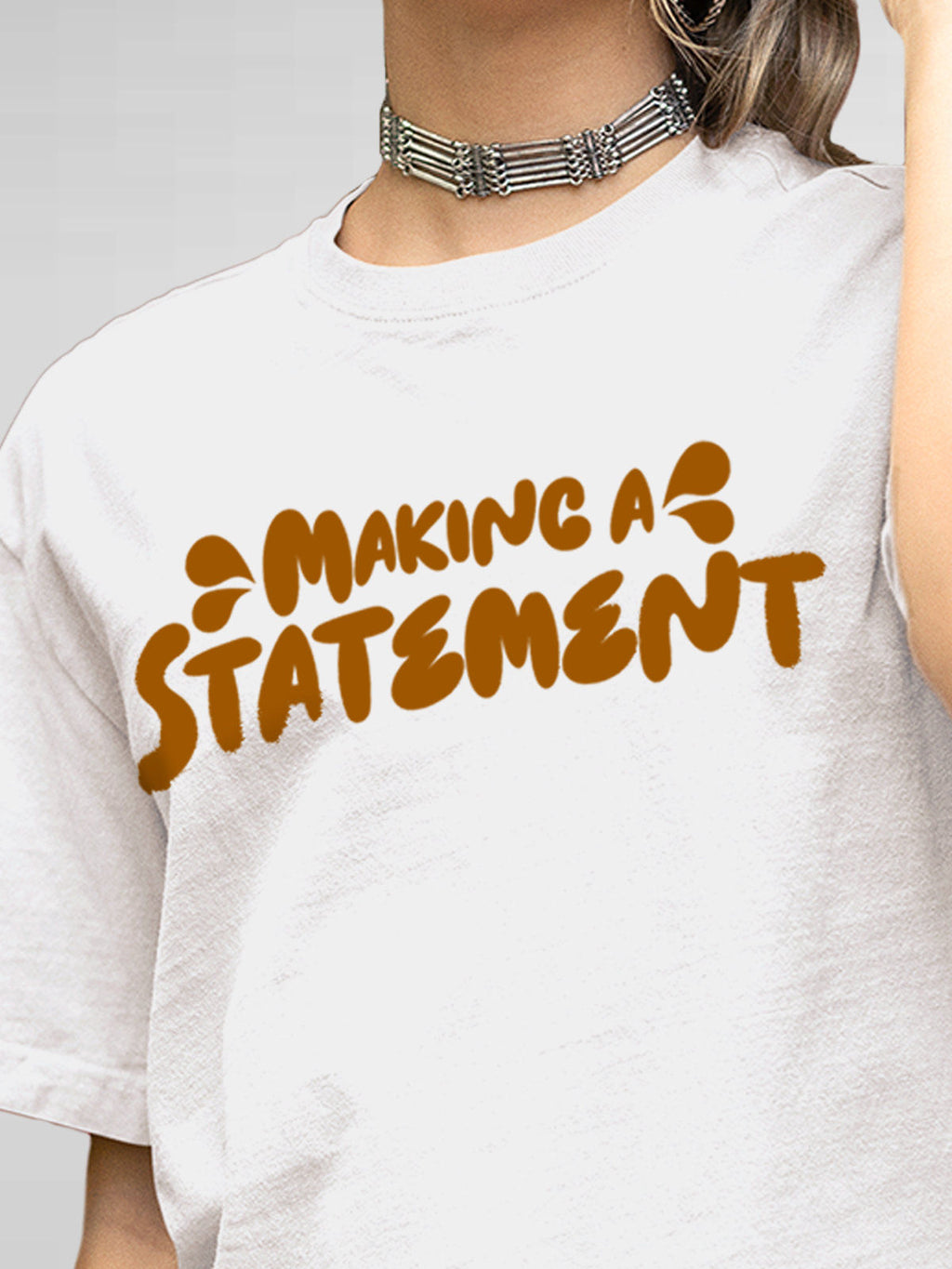 Close up of 'Making A Statement' design on Women's White Round Neck T-shirt, highlighting intricate details and vibrant print.