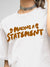 Close up of 'Making A Statement' design on Women's White Round Neck T-shirt, highlighting intricate details and vibrant print.