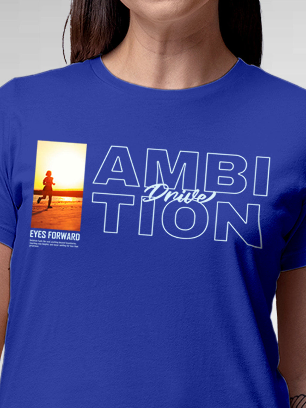 Close up of 'Ambition & Drive' design on Women's Blue Round Neck T-shirt, highlighting intricate details and vibrant print.