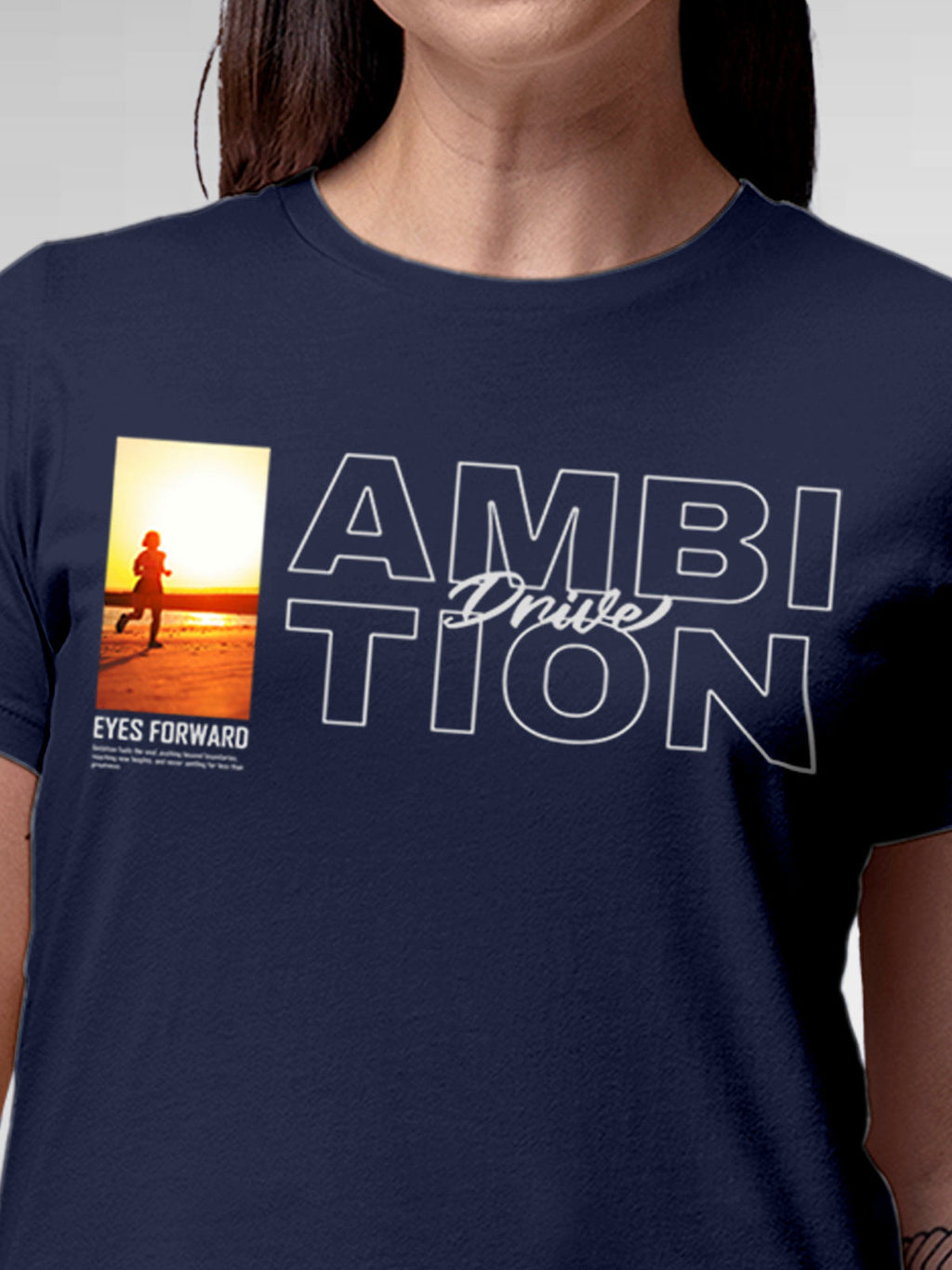 Close up of 'Ambition & Drive' design on Women's Navy Blue Round Neck T-shirt, highlighting intricate details and vibrant print.