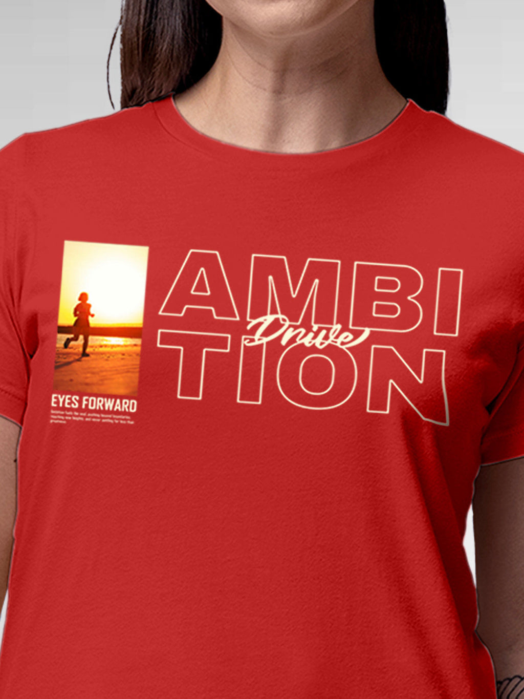 Close up of 'Ambition & Drive' design on Women's Red Round Neck T-shirt, highlighting intricate details and vibrant print.
