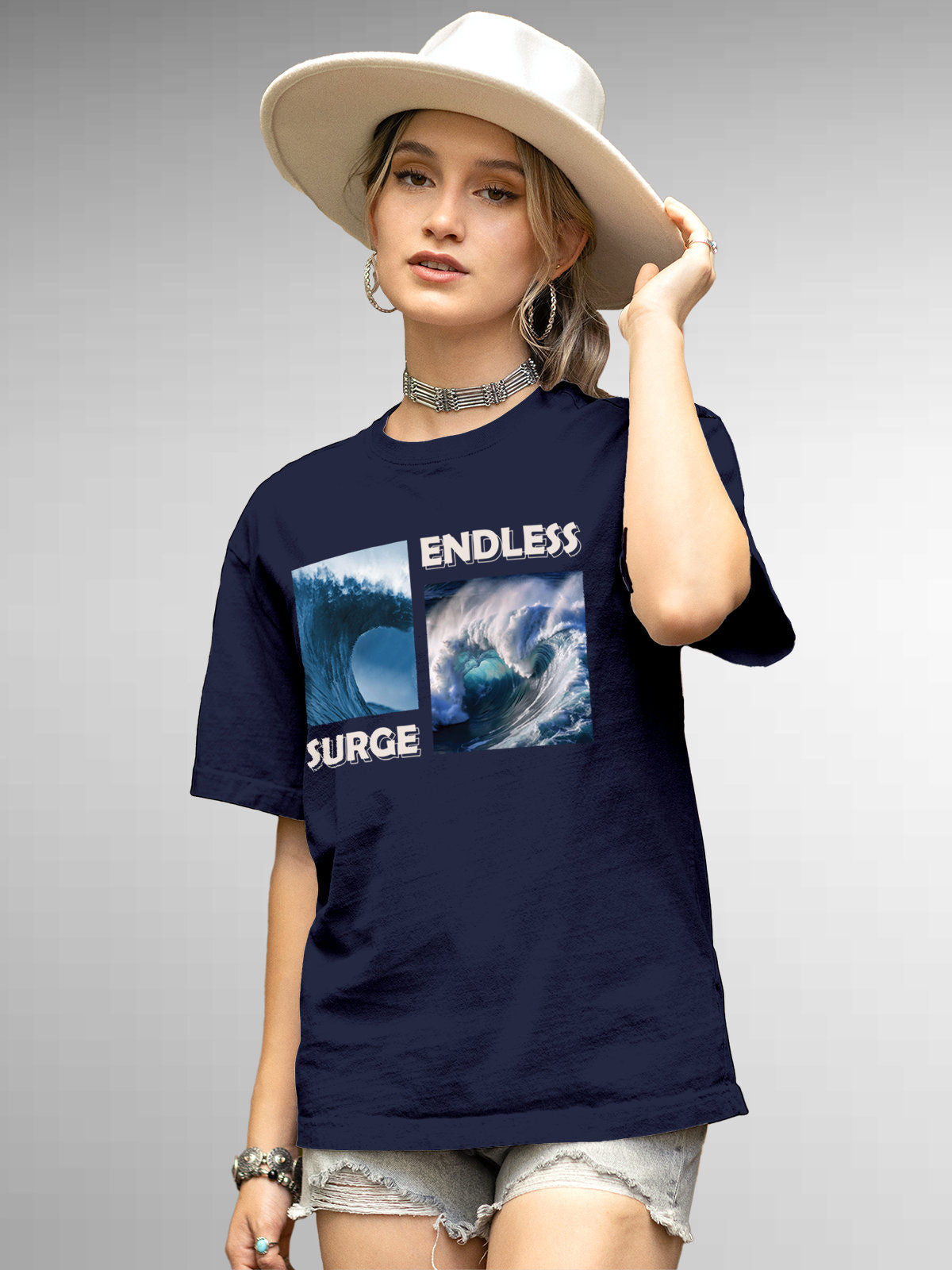 Model wearing Women's Navy Blue Round Neck T-shirt with 'Endless Surge' design, offering effortless style and premium comfort