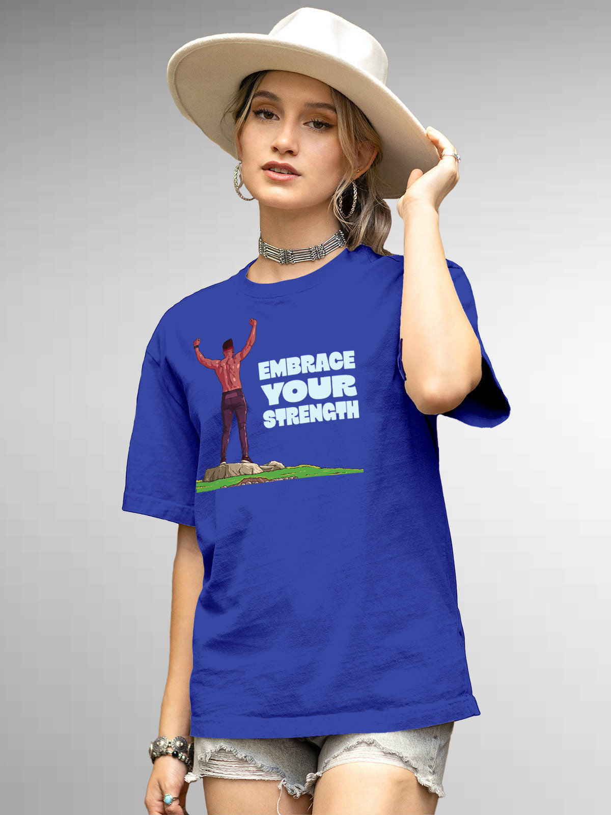 Model wearing Women's Blue Round Neck T-shirt with 'Embrace Your Strength' design, offering effortless style and premium comfort