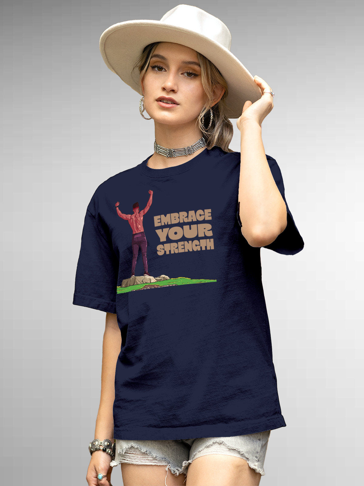 Model wearing Women's Navy Blue Round Neck T-shirt with 'Embrace Your Strength' design, offering effortless style and premium comfort